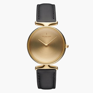 UN28GOVEBLBM UN32GOVEBLBM &Unika gold watches for women with brushed dial and black vegan strap